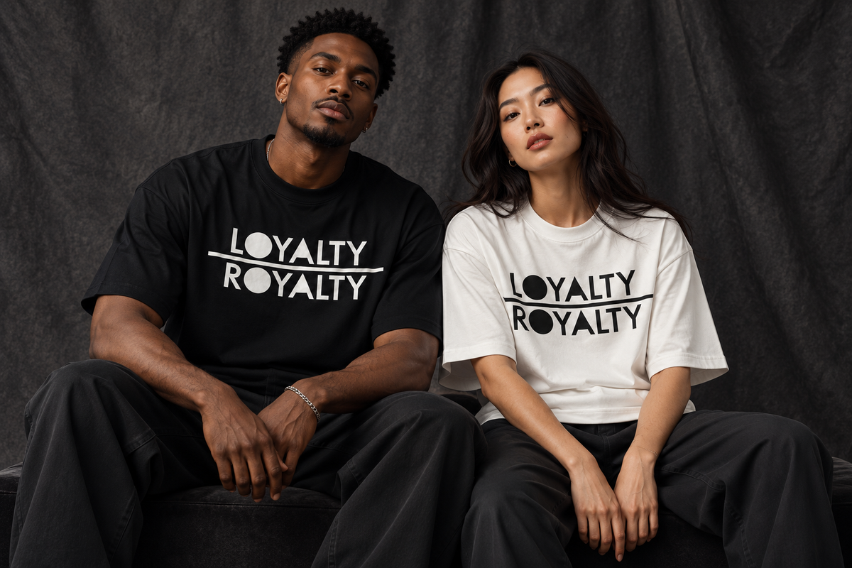 Two models wearing the black and white NewishTrendz Loyalty Over Royalty shirts